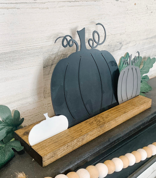 Neutral Color Fall Pumpkins on Wood Stand