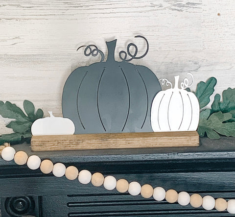 Neutral Color Fall Pumpkins on Wood Stand