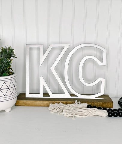 KC Outline on Wood Stand